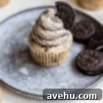 A cupcake with Oreo buttercream frosting swirled on top.
