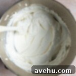 Whipped cream in a mixing bowl.