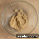 Decadent Triple Caramel Cake 3 Creamed butter and sugars in a bowl.