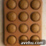 Easy Moist Coffee Cupcakes 5 Baked coffee cupcakes in a muffin tin