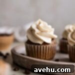 Easy Moist Coffee Cupcakes 6 A coffee cupcake on a brown plate.