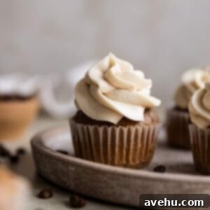 A coffee cupcake on a brown plate.