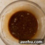 Easy Moist Coffee Cupcakes 3 Wet ingredients combined in a glass bowl.