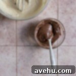 Easy and Moist One Bowl Wonder Marble Cupcakes 6 A small bowl of chocolate batter on a pink surface.