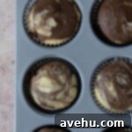 Easy and Moist One Bowl Wonder Marble Cupcakes 9 Baked marble cupcakes in a muffin tin.