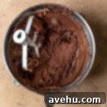 Easy and Moist One Bowl Wonder Marble Cupcakes 11 Chocolate frosting in a bowl.