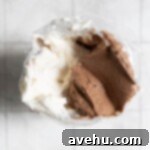 Easy and Moist One Bowl Wonder Marble Cupcakes 12 Chocolate and vanilla frosting combine in a piping bag.