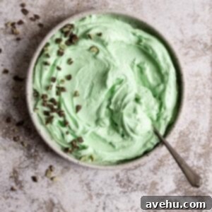 Minty Fresh 5-Minute Frosting 2 A bowl of mint frosting top with chopped andes mints.