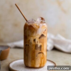 Barista-Style Caramel Iced Coffee Made Simple 2 Caramel iced coffee on a white plate.