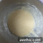 Wet ingredients for a cake mixed together in a mixing bowl.