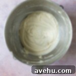 Vanilla cake batter in a mixing bowl.