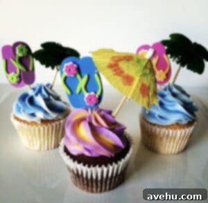 Sweet Secrets to Adorable Cupcakes 6 Hawaiian themed cupcakes on a white platter.