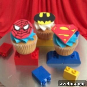 Sweet Secrets to Adorable Cupcakes 8 Superhero themes cupcakes on a cake stand.