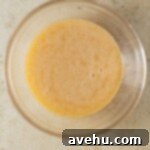 Ultimate Banana Bread Brownies 3 The base batter for banana bread brownies in a glass bowl.