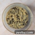 Simple Chocolate Chip Cookies No Brown Sugar Required 5 Chocolate chip cookie dough made without brown sugar in a glass bowl.