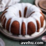 A bundt cake topped with a maple drizzle glaze.