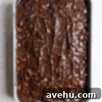 The Easiest Mississippi Mud Cake From Scratch 6 Chocolate frosting slathered on top of a marshmallow topped chocolate cake.