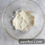 Instant Cream Cheese Glaze Perfection 3 Cream cheese and butter creamed in a bowl.