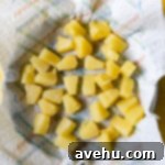 Artisan Pineapple Upside Down Minis 3 Pineapple chunks on a paper towel.