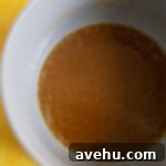 Artisan Pineapple Upside Down Minis 4 Sugar glaze in a pot.