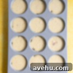 Artisan Pineapple Upside Down Minis 9 Cupcake batter in a muffin tin.