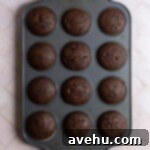 Heavenly Chocolate Strawberry Cupcakes 5 Chocolate cupcakes in a muffin tin.