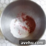 Heavenly Chocolate Strawberry Cupcakes 6 Powdered sugar and freeze dried strawberries in a mixing bowl.