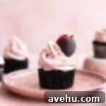 Heavenly Chocolate Strawberry Cupcakes 8 A chocolate strawberry cupcake topped with a chocolate covered strawberry.