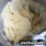 Zesty Citrus Bundt Bliss 4 Wet ingredients for cake batter mixed in a bowl.