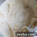 Zesty Citrus Bundt Bliss 6 The batter of an orange bundt cake.