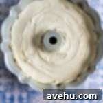 Zesty Citrus Bundt Bliss 7 Cake batter in a bundt pan.