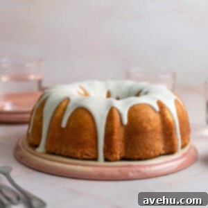 Effortless 2 Minute Thick Vanilla Glaze for Cakes 3 A vanilla bundt cake with a white glaze on top, ready to be served.