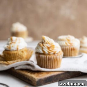 Effortless Caramel Drizzle 2 Caramel cupcakes topped with caramel frosting and glaze, showcasing a perfect drizzle.