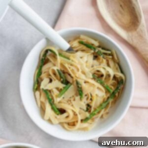 Asparagus and Lemon Fettuccine with Shaved Parmesan 5 This summer fettuccine is packed with asparagus, lemon, garlic, and parm for a delicious meal made in 30 minutes or less! #summerrecipe #fettuccine #30minmeal #easydinner frostingandfettuccine.com