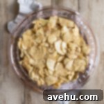 Effortless Cinnamon Roll Apple Pie 5 Apple pie filling in a pie pan.