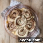 Effortless Cinnamon Roll Apple Pie 6 The top of a pre baked cinnamon roll pie.