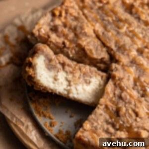 Velvet Apple Pie Cheesecake 2 An irresistible slice of Apple Pie Cheesecake, showcasing its layers.