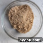 Velvet Apple Pie Cheesecake 4 Streusel in a glass bowl.