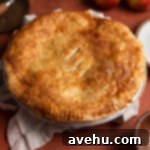 Crisp Puff Pastry Apple Dream 7 A freshly baked, golden-brown puff pastry apple pie, just out of the oven and cooling.