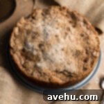 Effortless Graham Cracker Apple Pie 9 Freshly baked apple pie with streusel topping, cooling in a springform pan.
