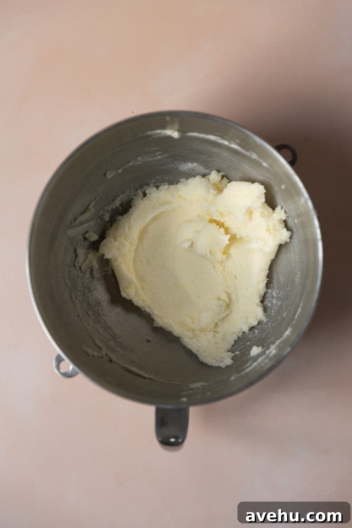Butter and sugar creamed in a mixing bowl.
