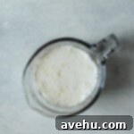 Bright & Zesty Lemon Blueberry Cupcakes 14 Buttermilk in a measuring cup.