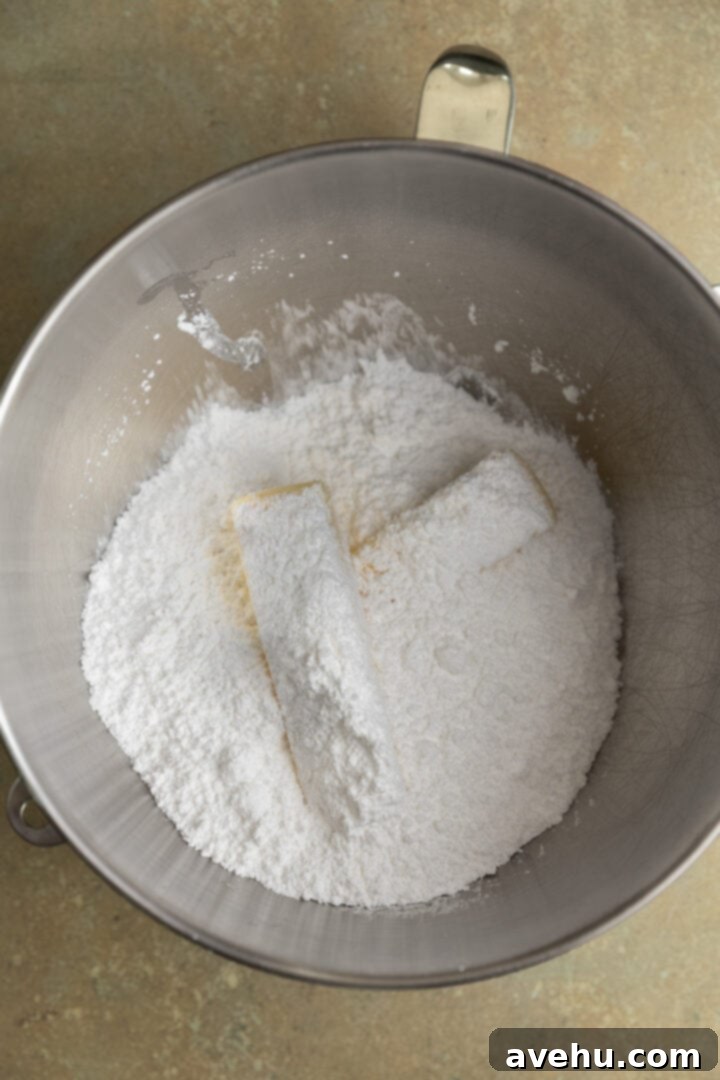 Effortless 5 Minute Pistachio Frosting 4 Powdered sugar and butter in a mixing bowl.