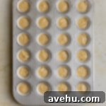 25 Minute Dreamy Mini Banana Bites 5 Mini banana muffin batter in a mini muffin tin.