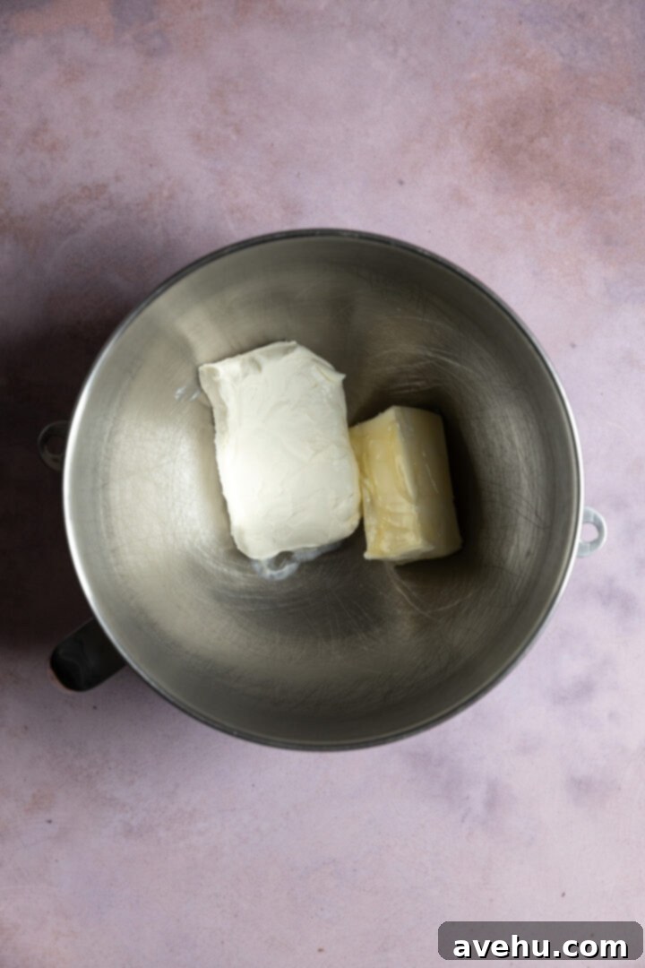 Orange Zest Cream Cheese Cloud 4 Cream cheese and butter added to a mixing bowl.