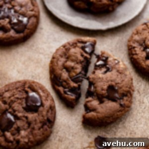 Quick 25-Minute Double Chocolate Chip Cookies 6 A double chocolate chip cookie cut in half with gooey chocolate.
