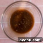 Melted butter and sugar in a glass bowl.