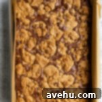 Effortless Chewy Brookie Bliss 7 Freshly baked brookies in a 9x13 inch pan, featuring a crinkled brownie top and golden cookie dough.