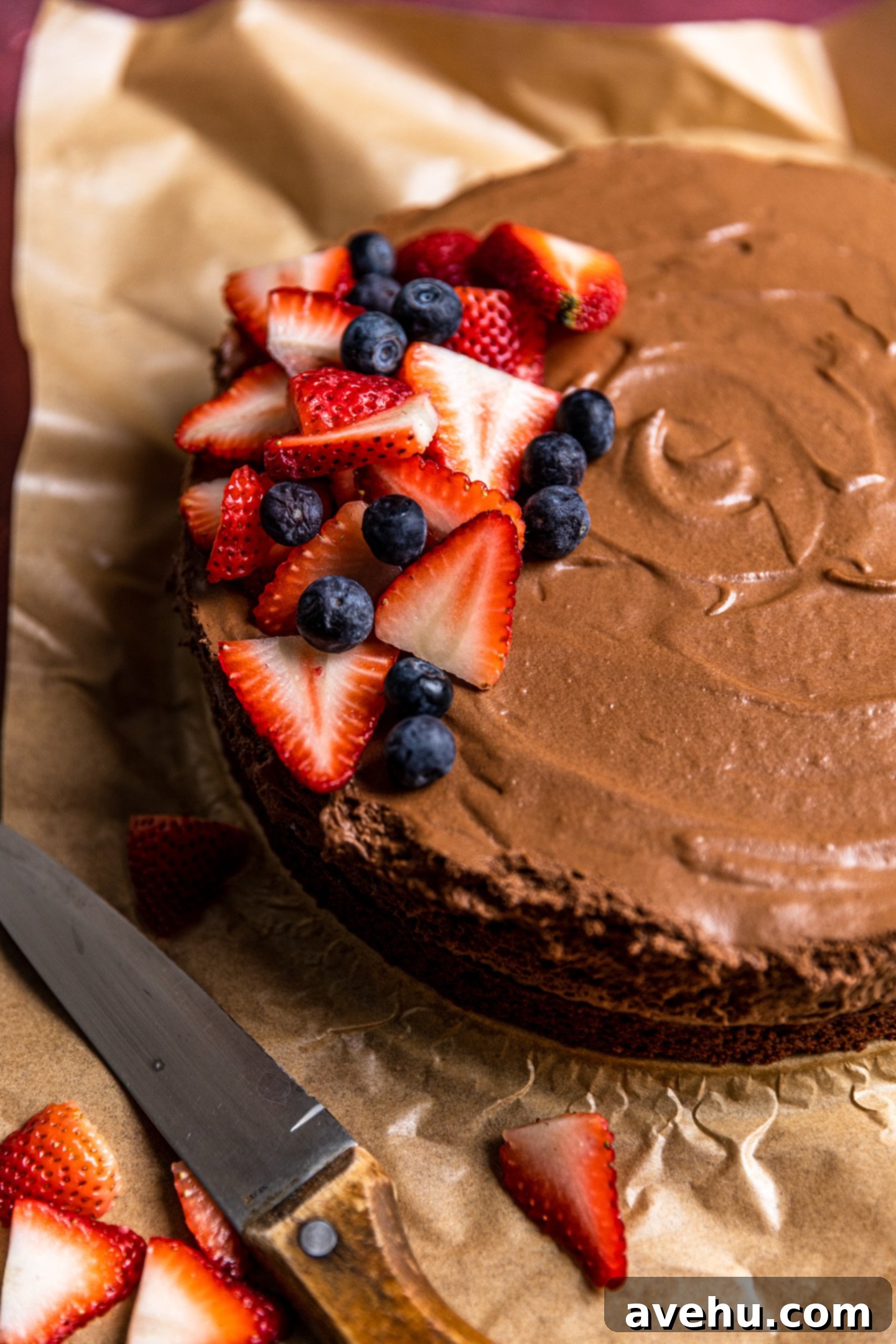 Velvet Chocolate Mousse Cake No Gelatin Needed 2 A chocolate mousse cake with berries on top.