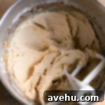 Silky Smooth Cookie Dough Frosting 14 Cookie dough frosting without chocolate chips whipped in a mixing bowl.